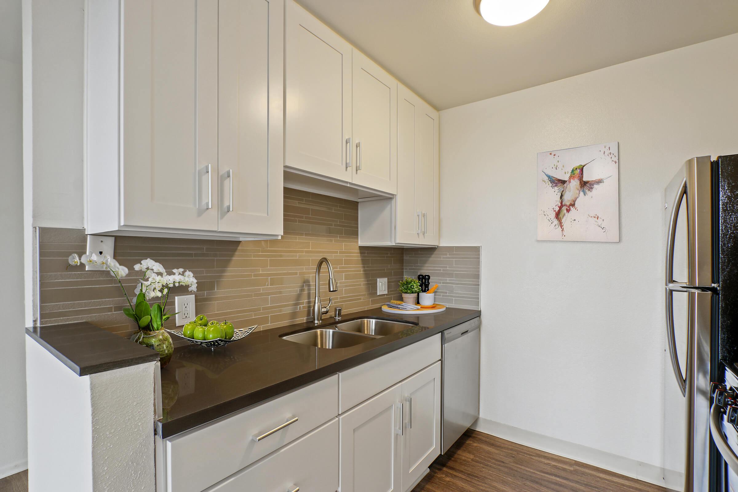 a kitchen with a sink and a microwave