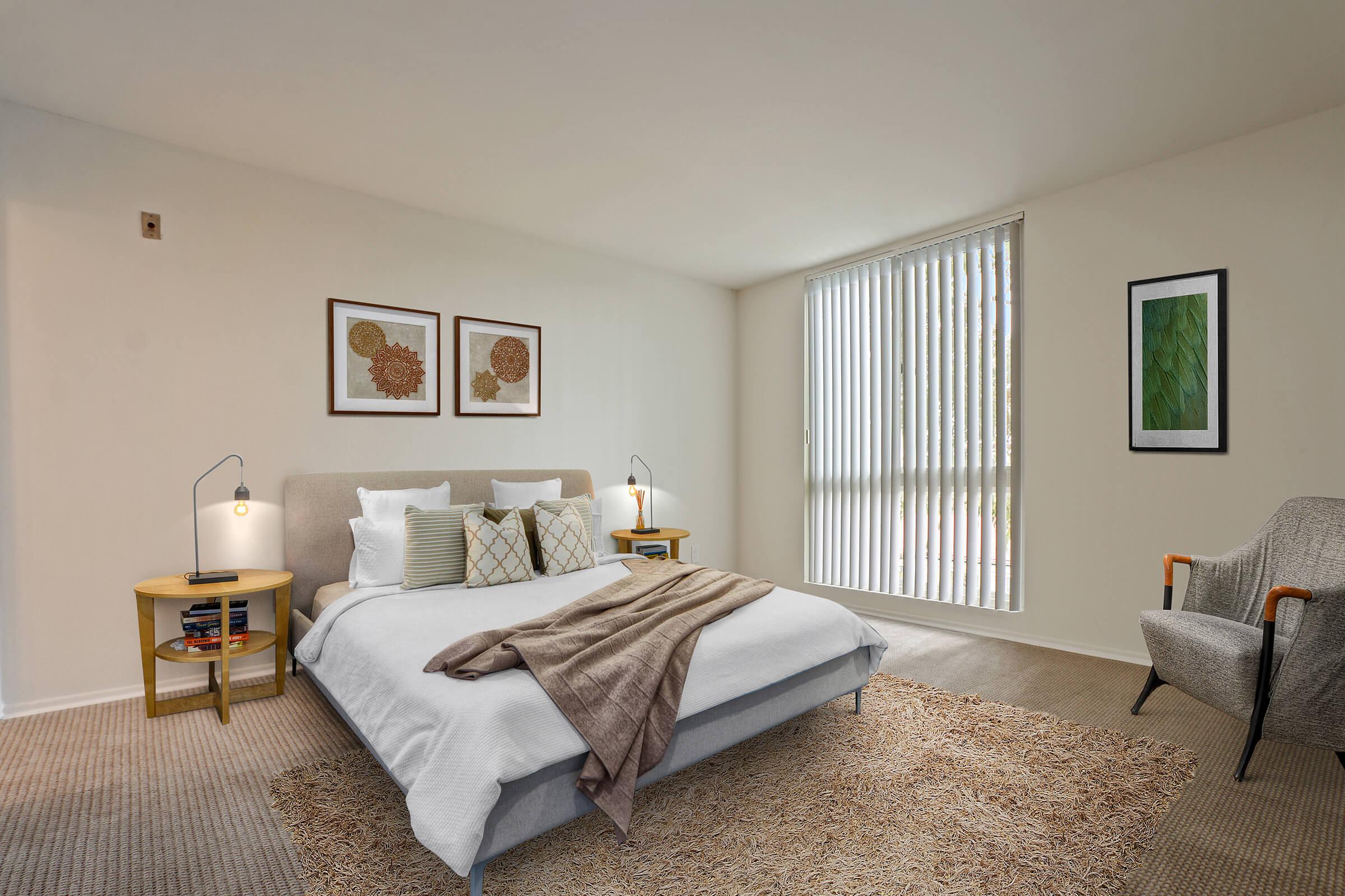 a bedroom with a view of a living room