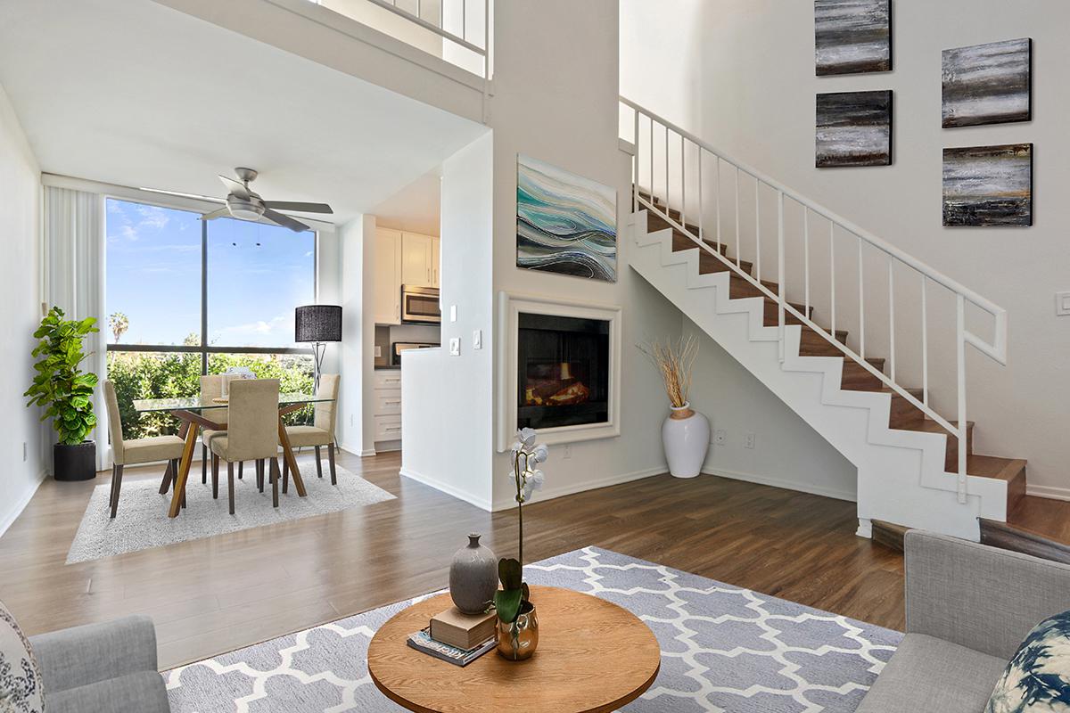 a living room filled with furniture and a fire place