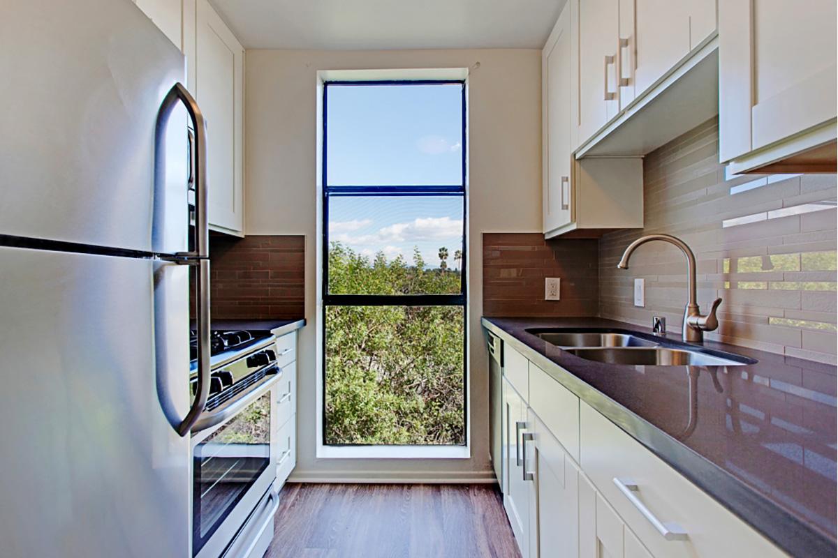 a stainless steel refrigerator in a kitchen