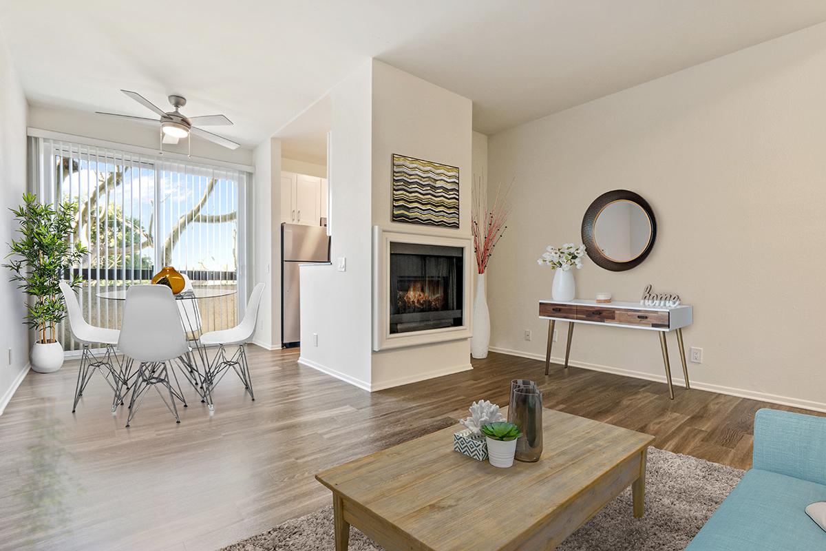 a living room filled with furniture and a fire place