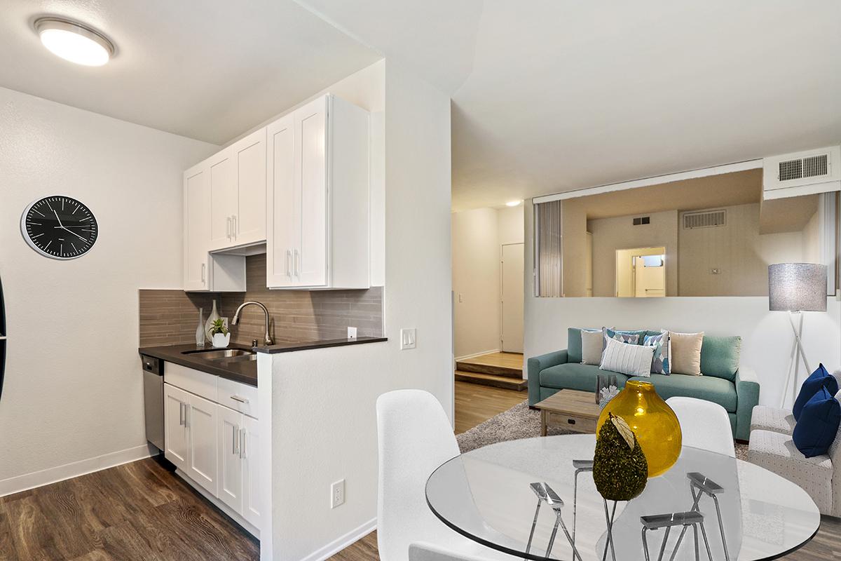 a kitchen filled with lots of furniture