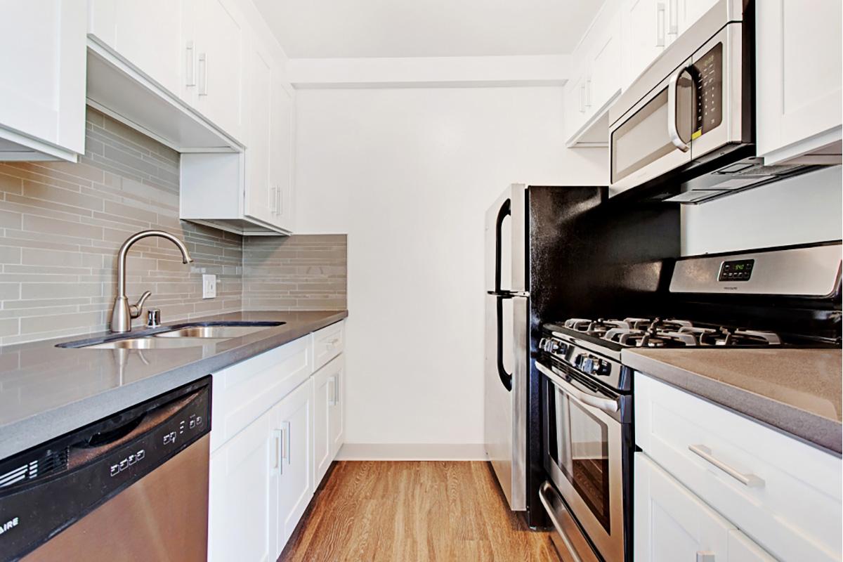 a kitchen with a stove top oven