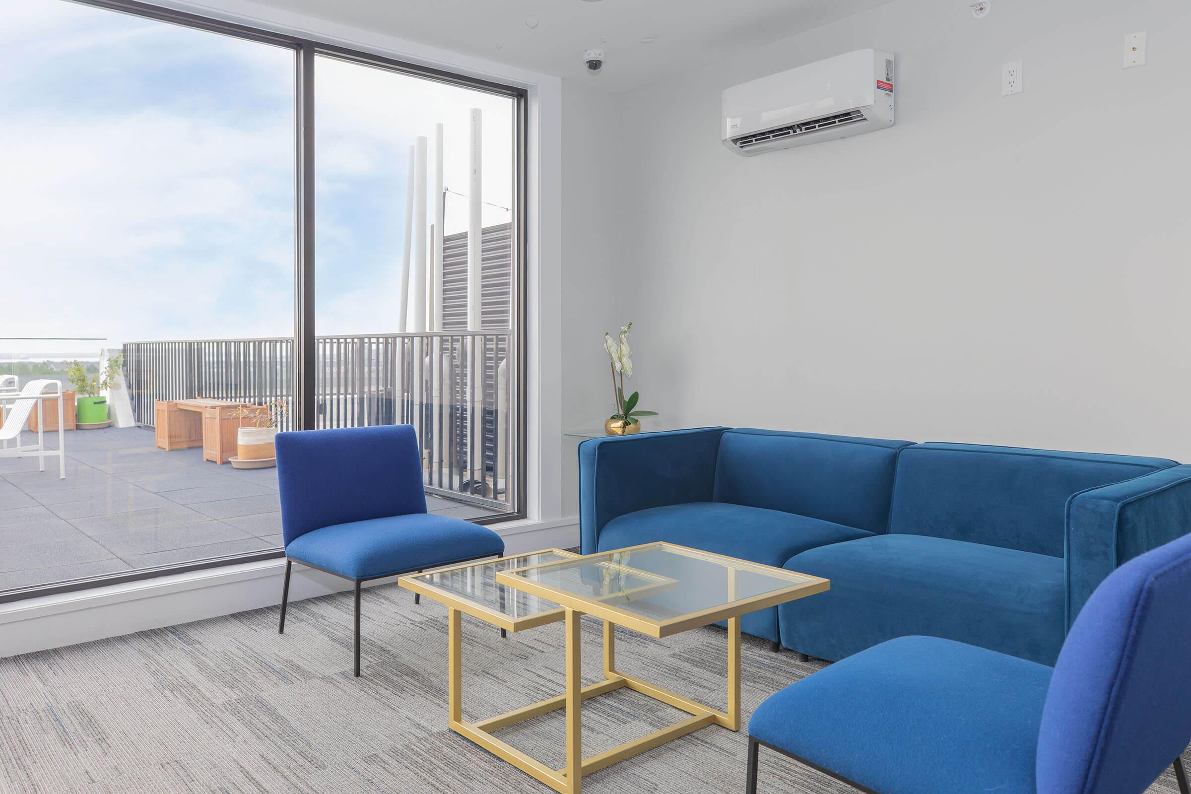 a living room with a blue chair