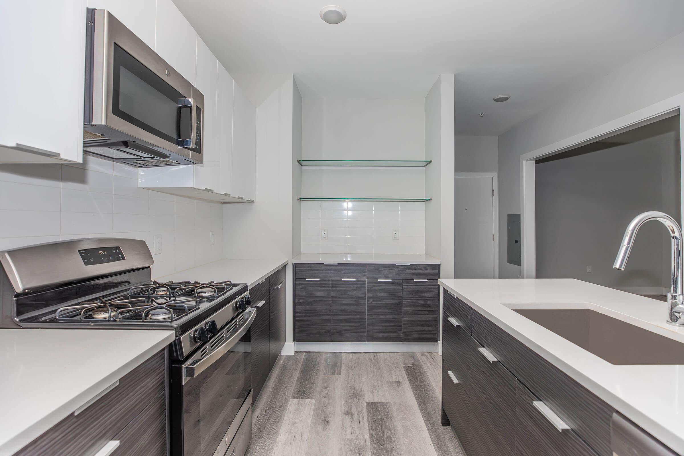 a modern kitchen with stainless steel appliances