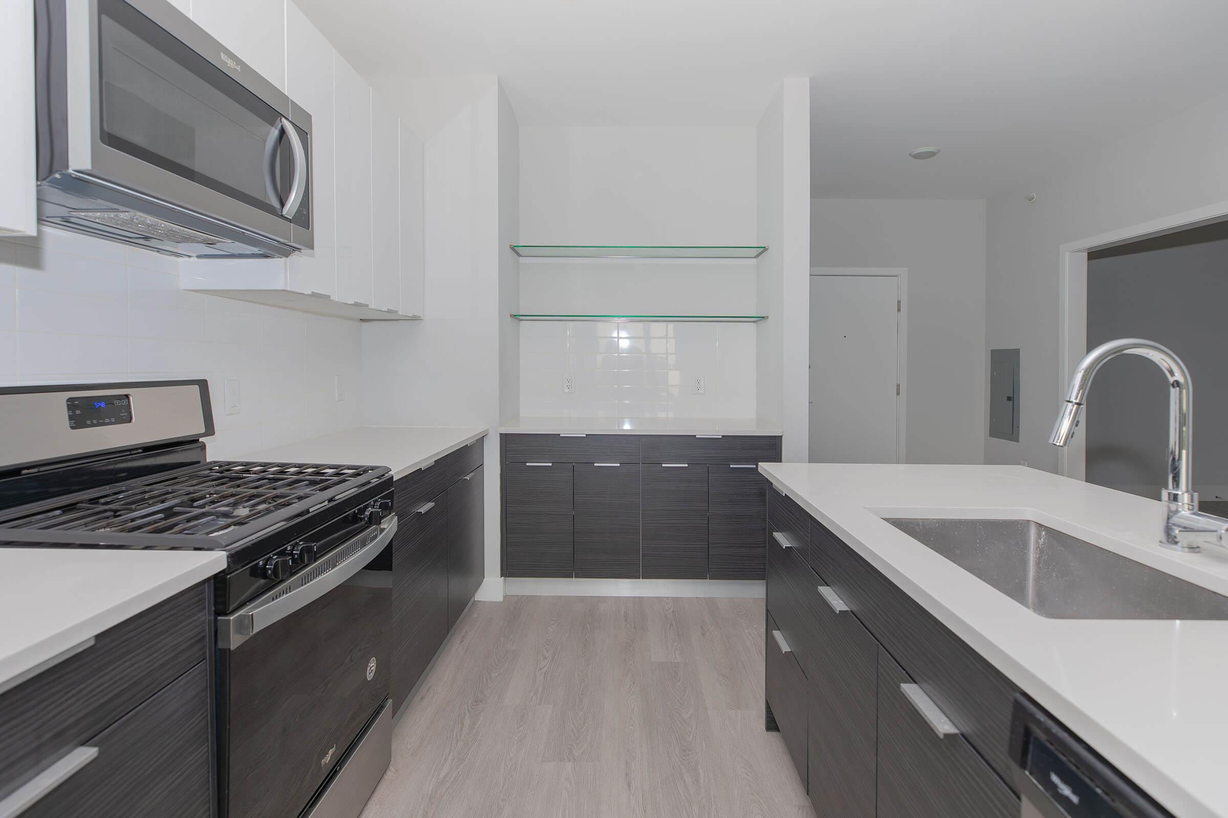 a kitchen with a stove and a sink