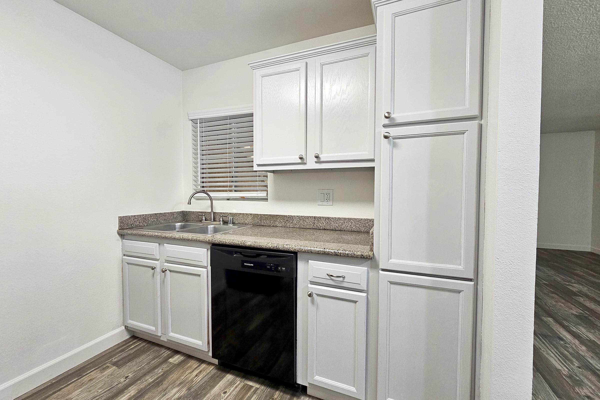 a kitchen with a stove and a refrigerator