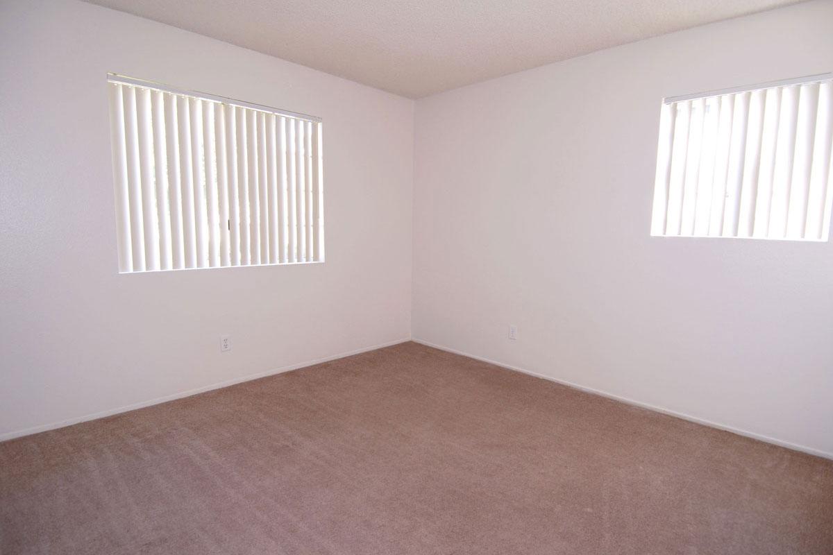 a bedroom with a bed in a room