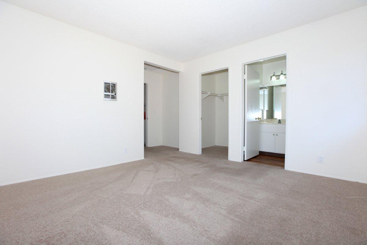 a bedroom with a bed in a room