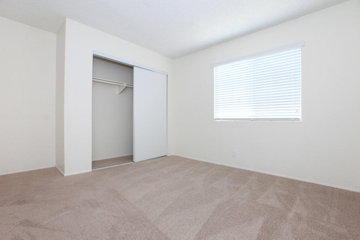 a bedroom with a bed in a room