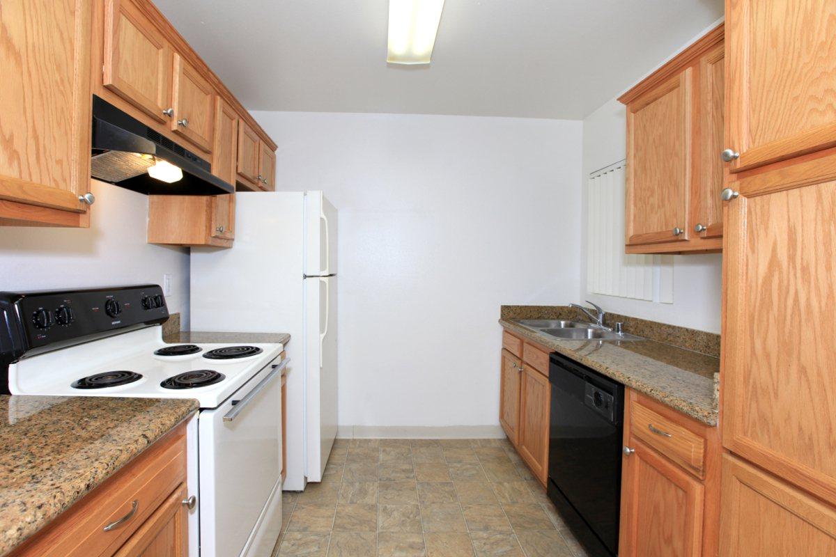 a kitchen with a stove top oven