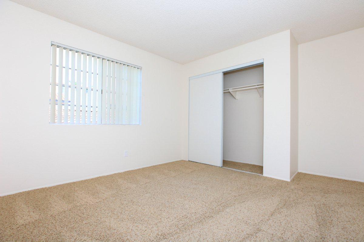 a bedroom with a bed in a room