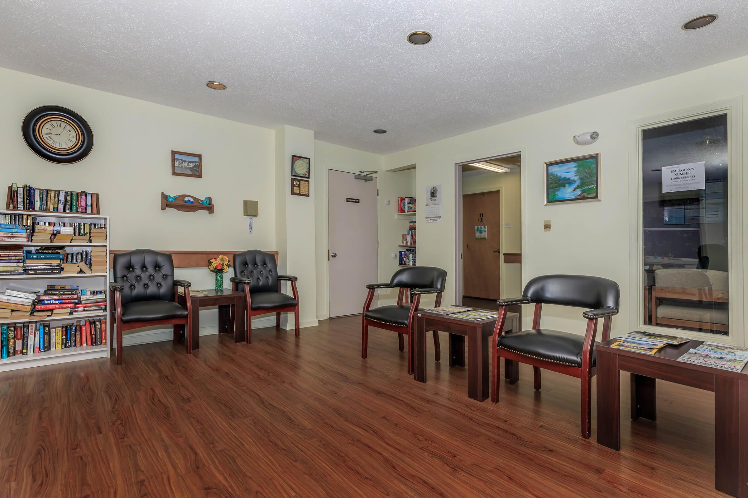 a living room filled with furniture and a flat screen tv