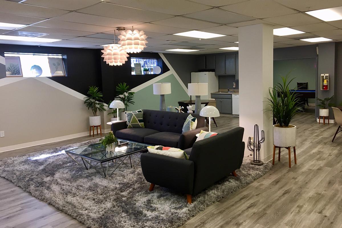 a living room filled with furniture and a flat screen tv