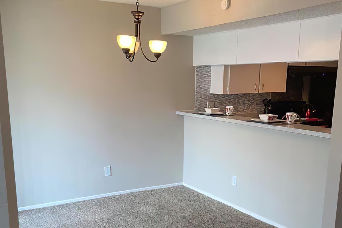 a kitchen with a sink and a mirror