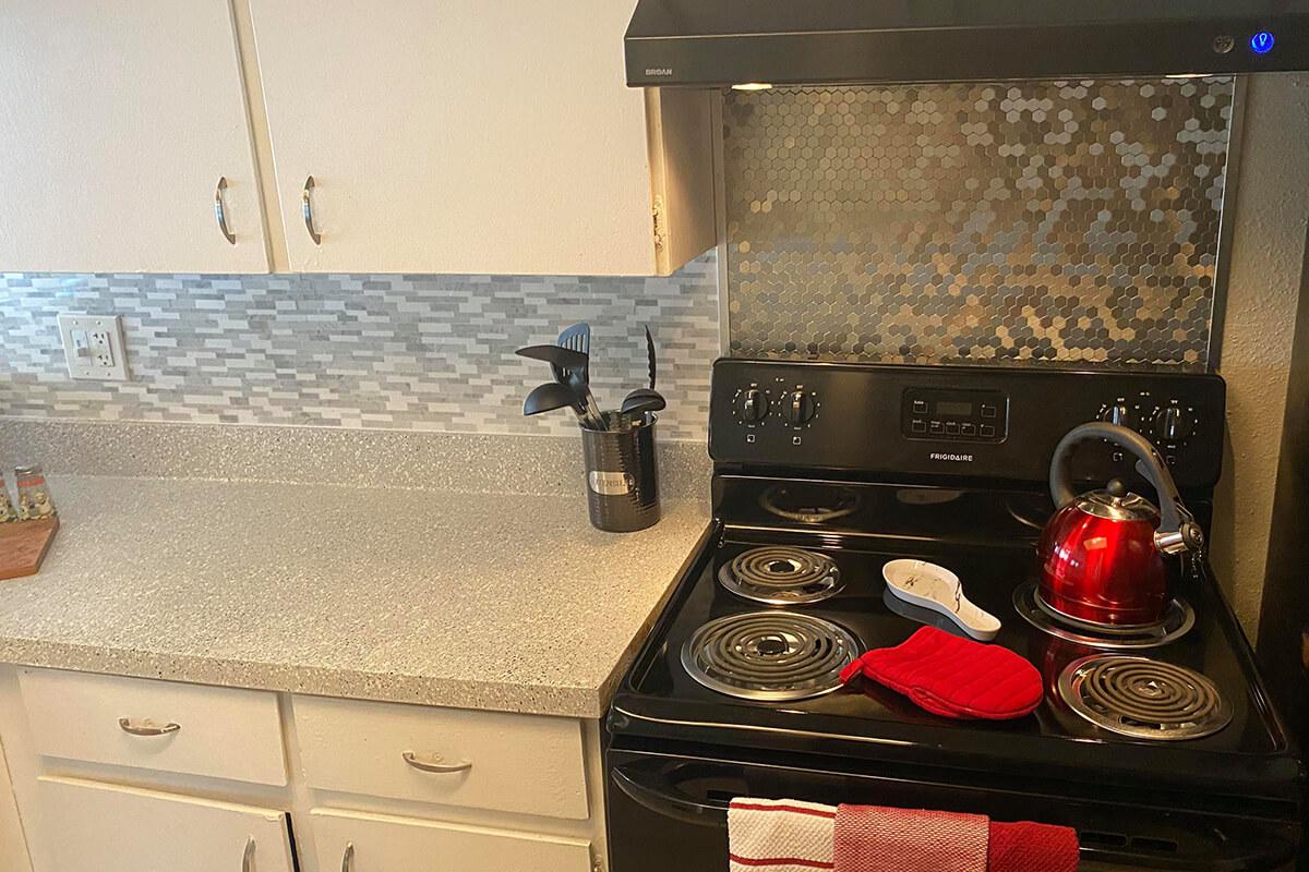 a stove top oven sitting inside of a car