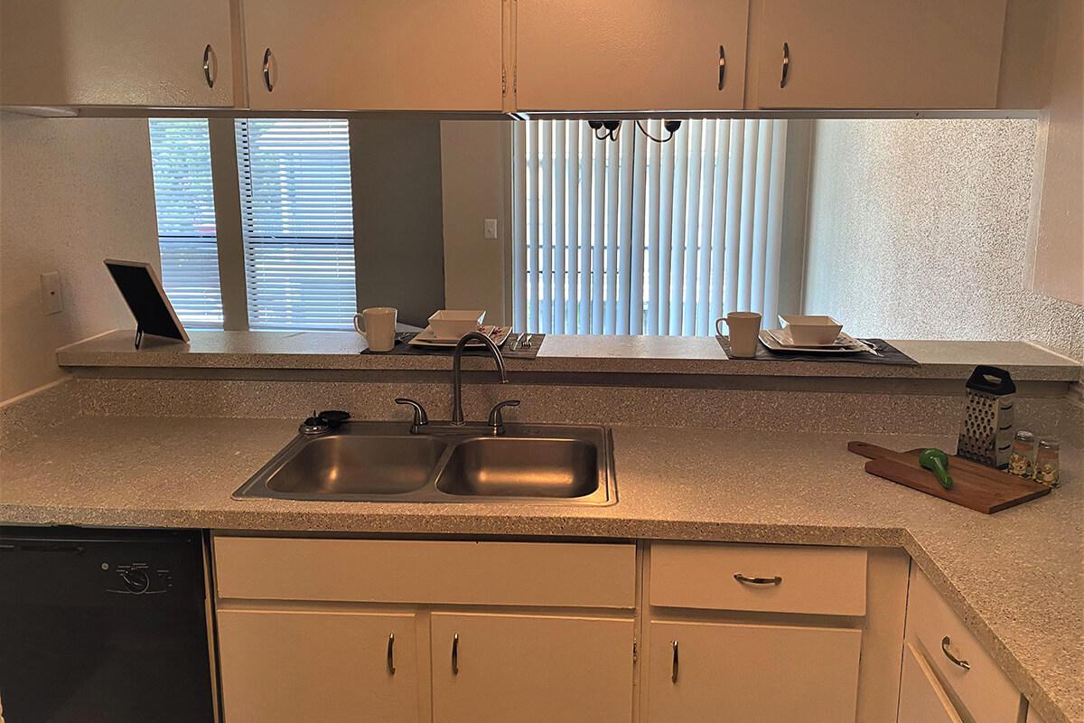 a stove top oven sitting inside of a kitchen