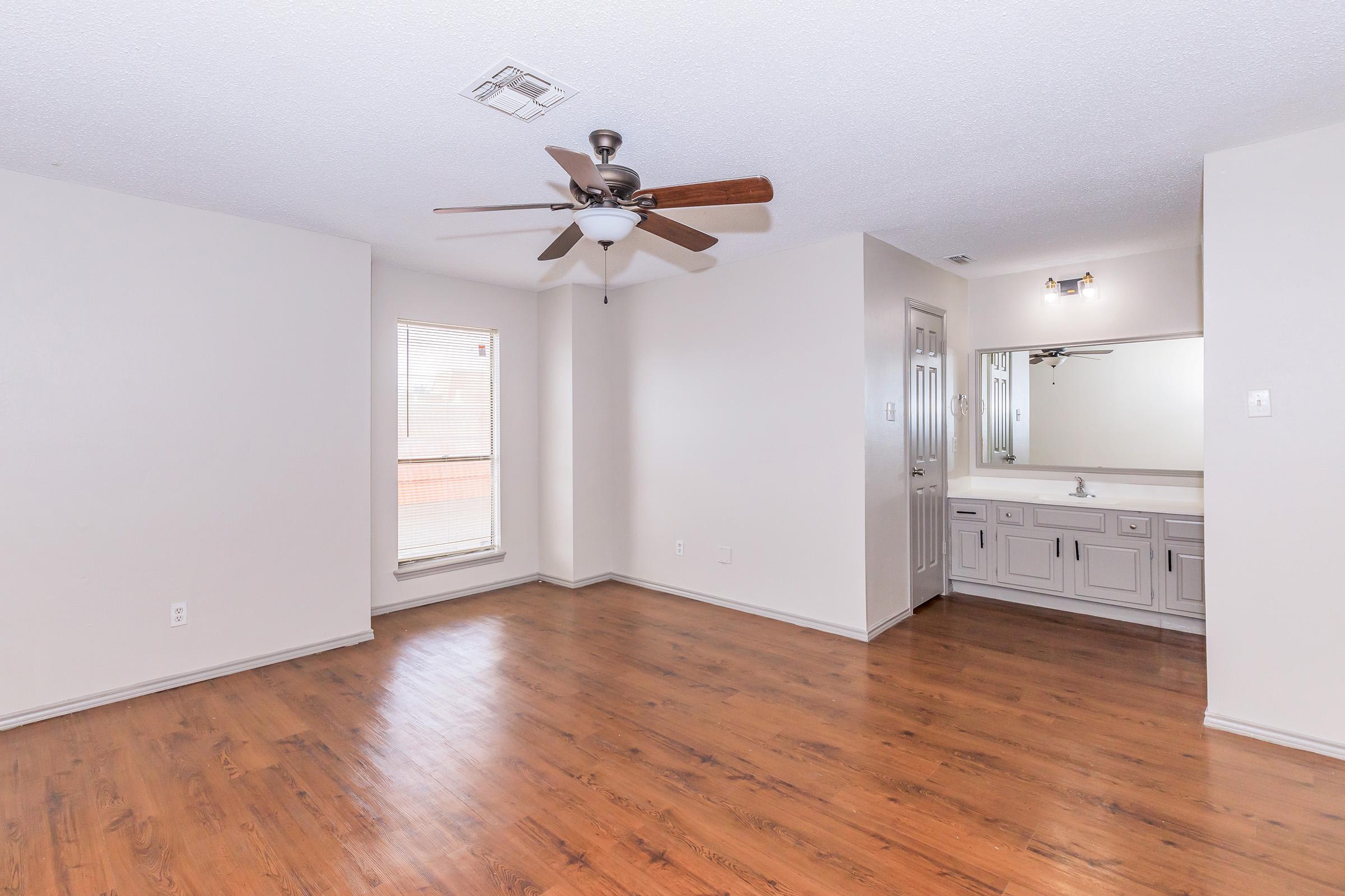 a kitchen with a wood floor