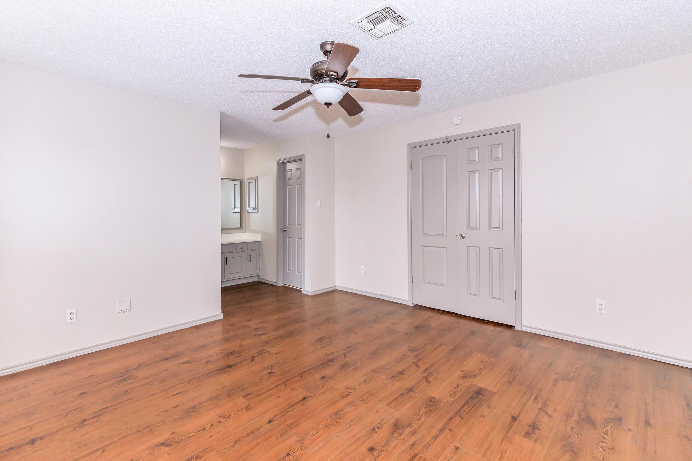 a kitchen with a wood floor