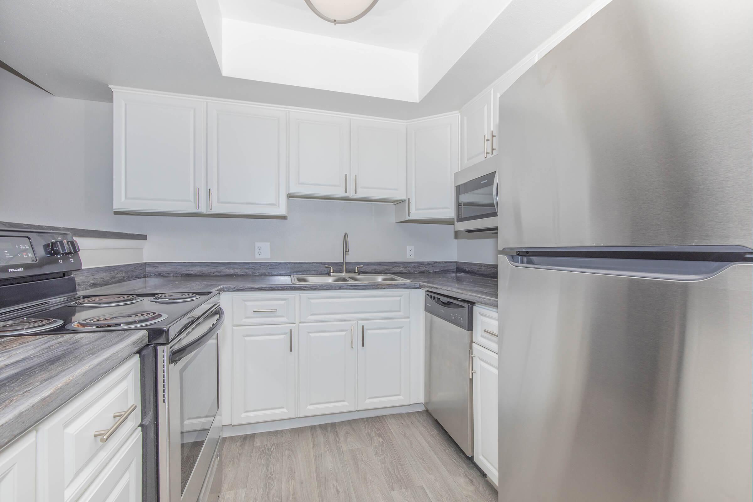 a stainless steel refrigerator in a kitchen