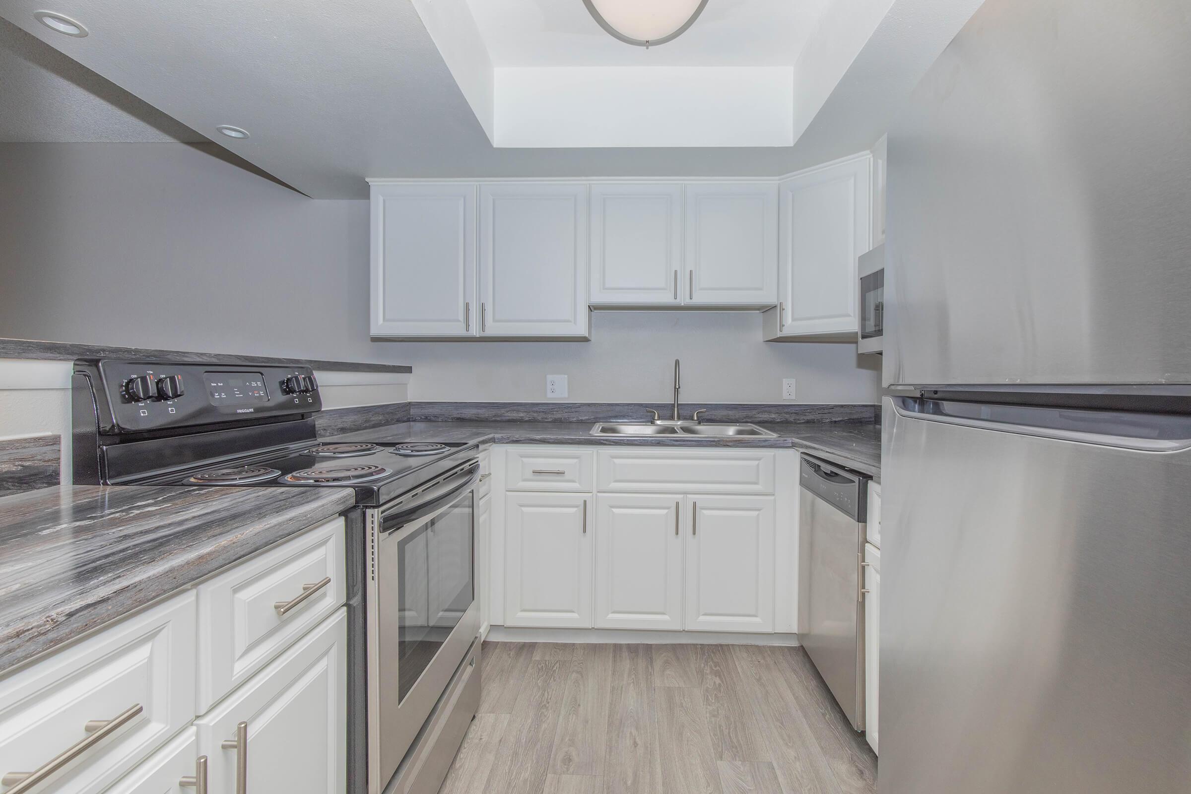 a large kitchen with stainless steel appliances