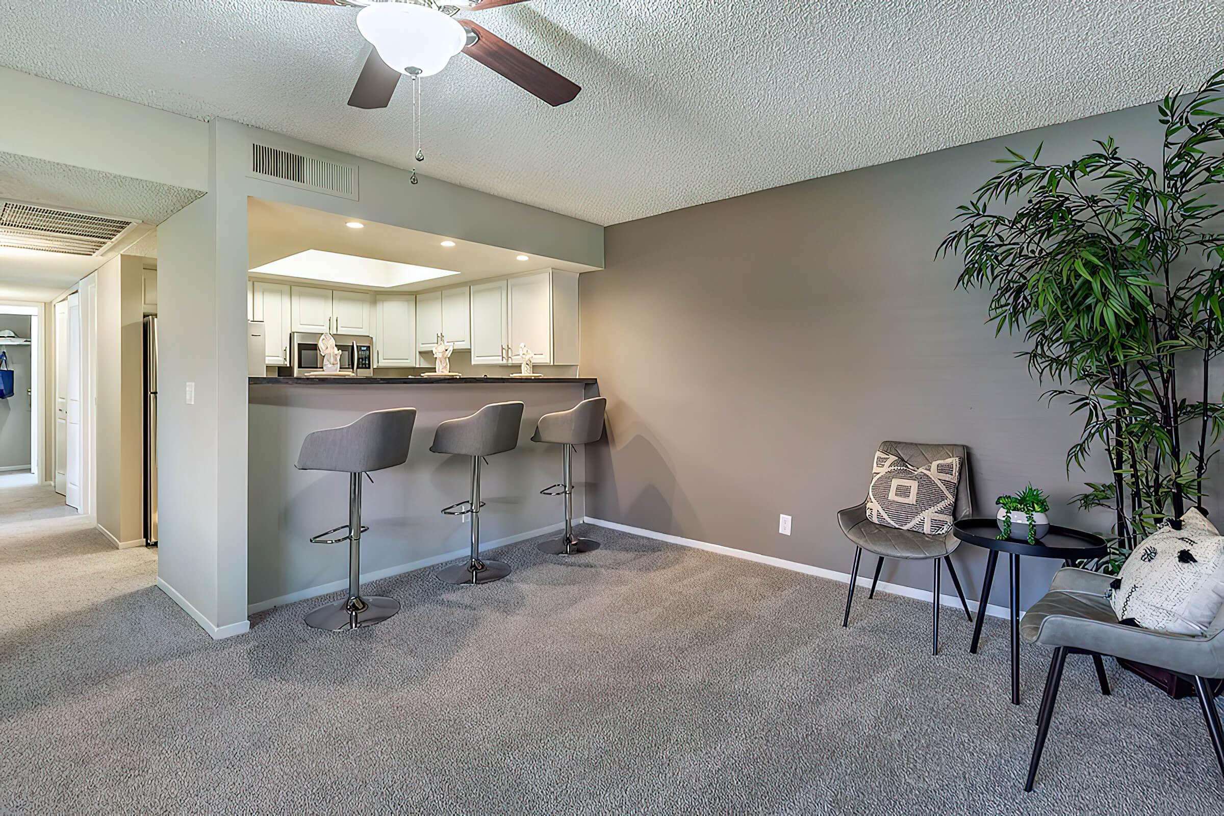 a room filled with furniture and a large window