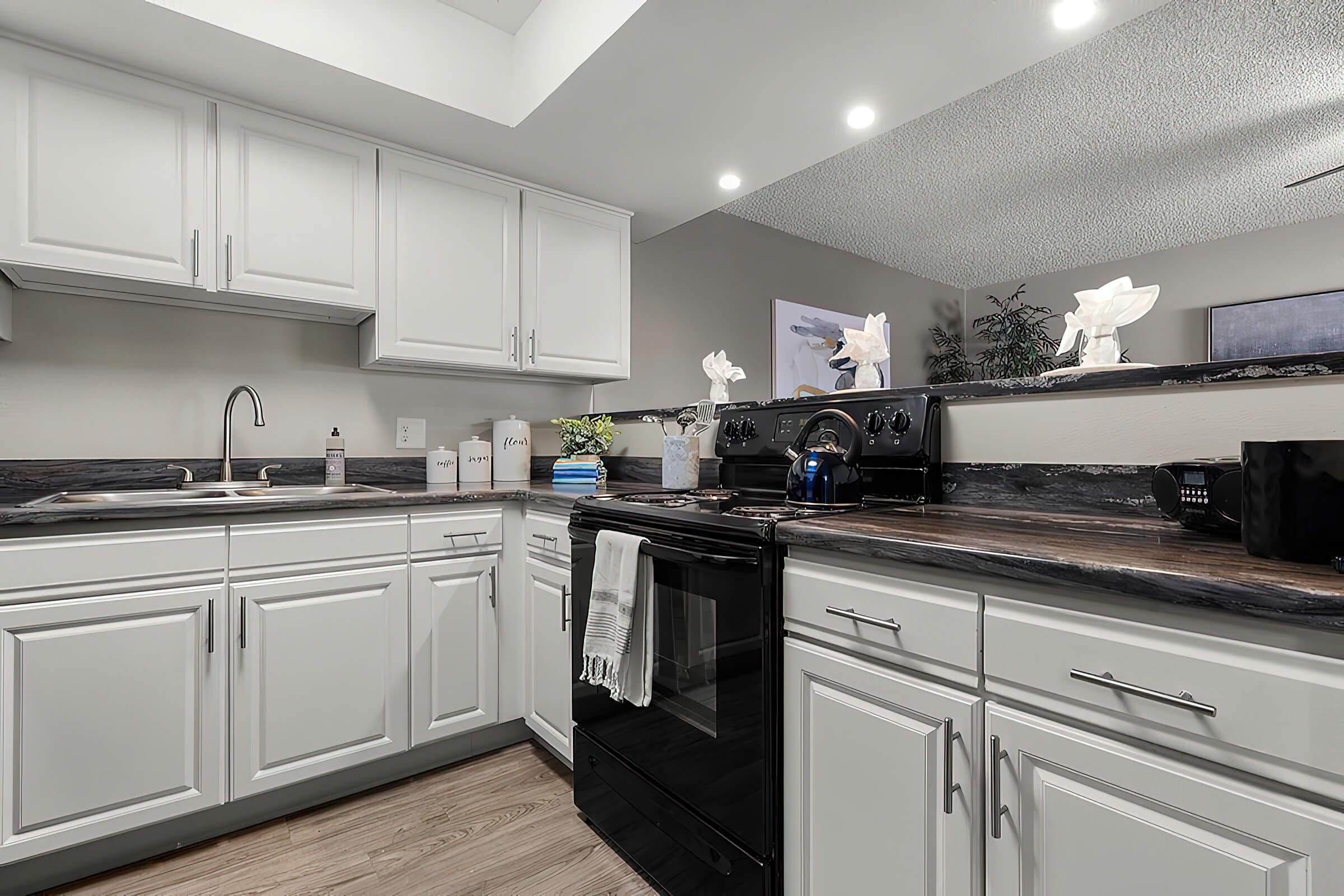 a large kitchen with stainless steel appliances