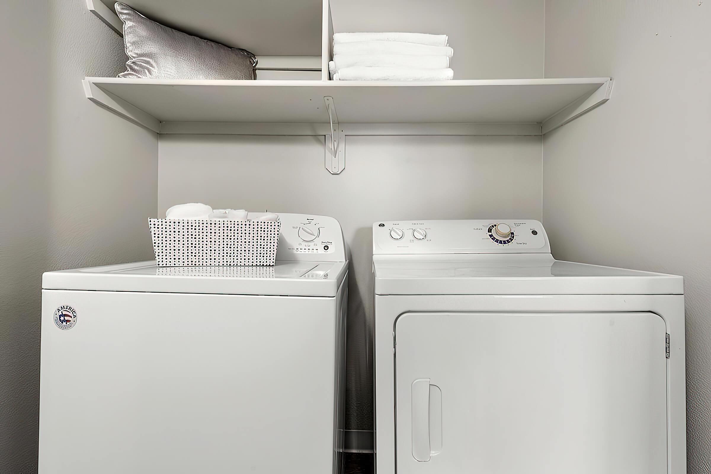 a microwave oven sitting on top of a refrigerator