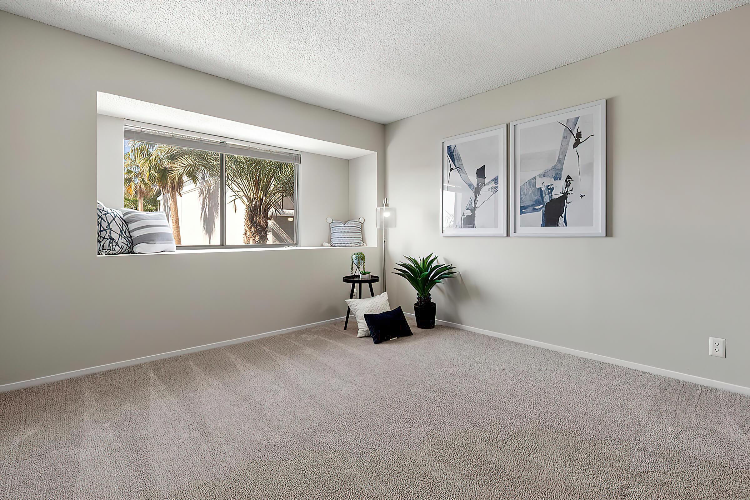 a bedroom with a large window