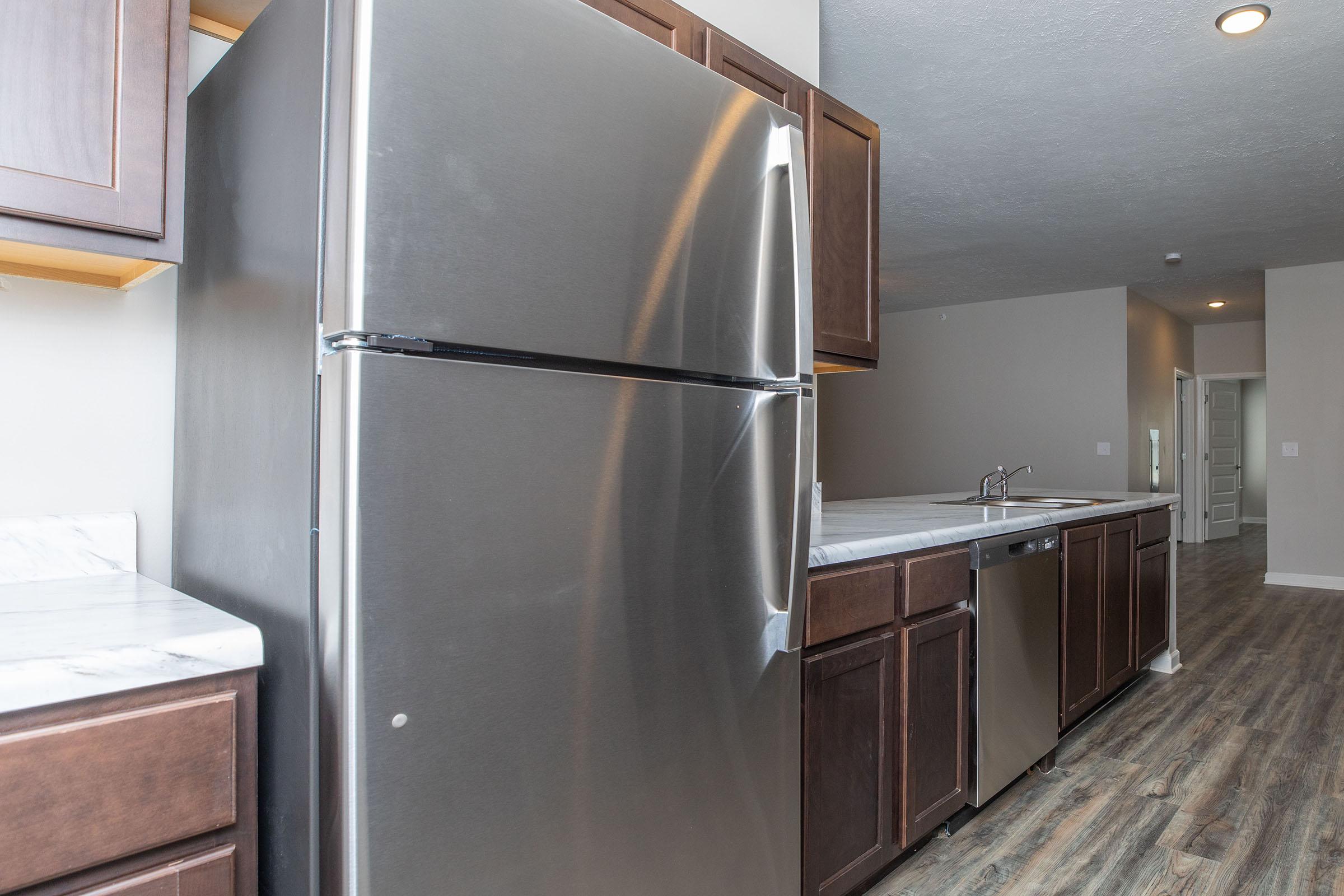 a stainless steel refrigerator in a kitchen