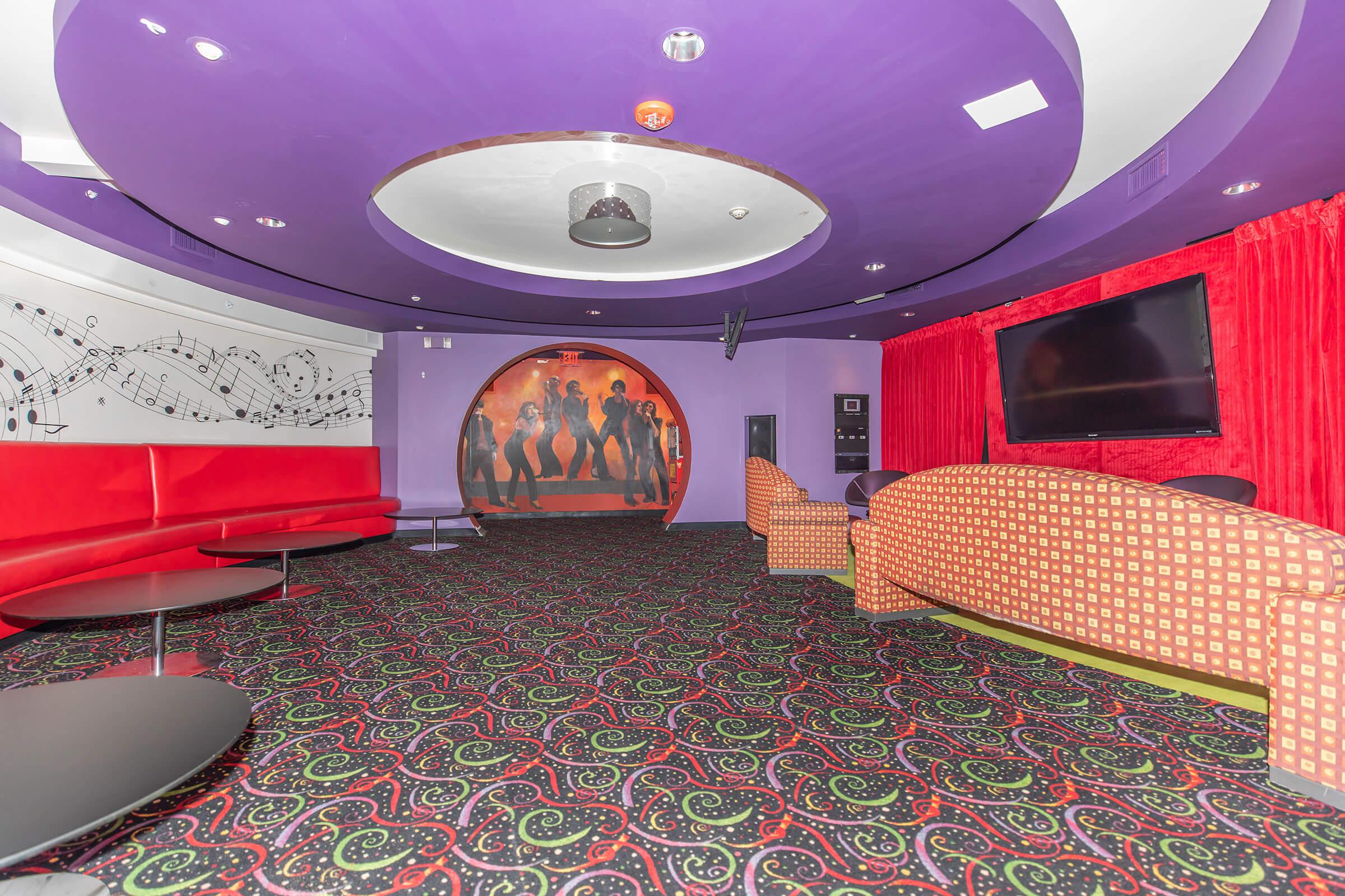 The Orsini community room with a purple ceiling