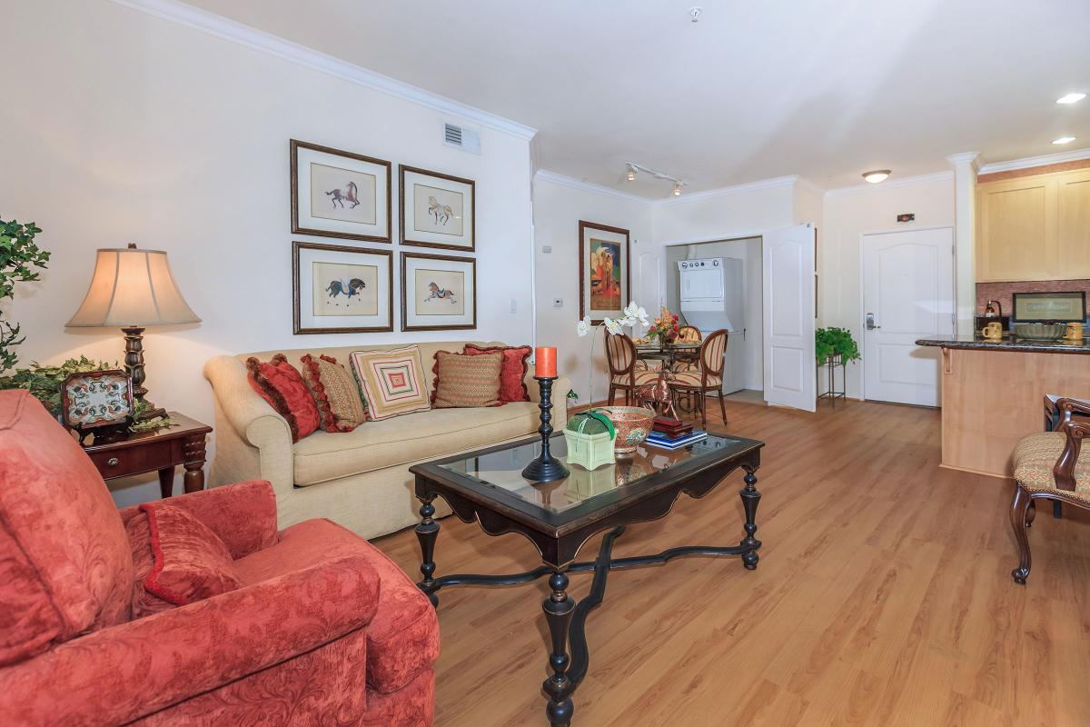a living room filled with furniture and a fire place