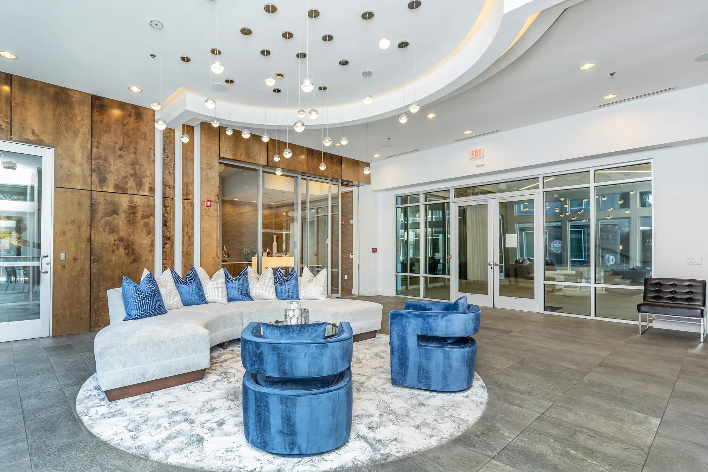 a room filled with furniture and a blue suitcase