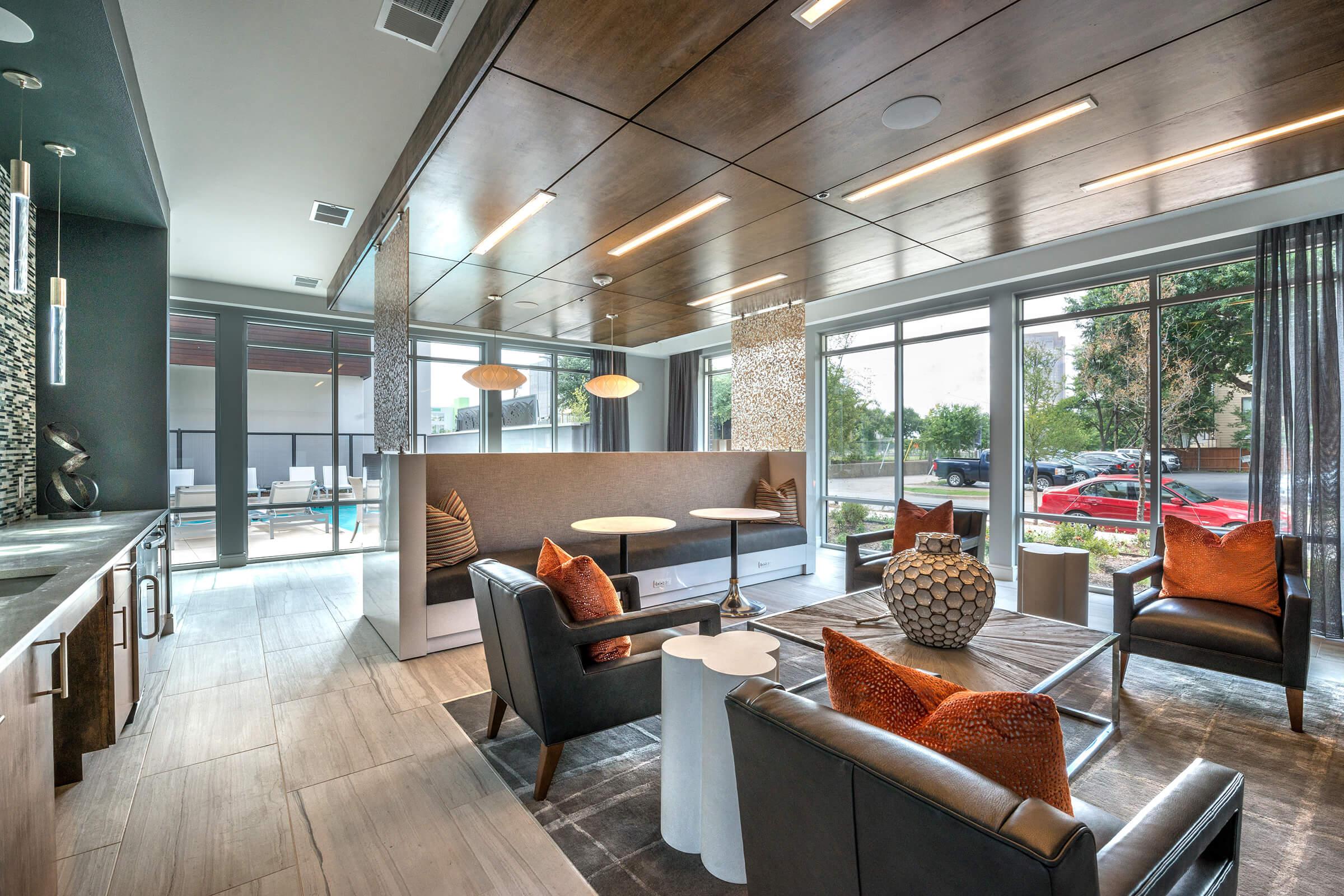 a room filled with furniture next to a building