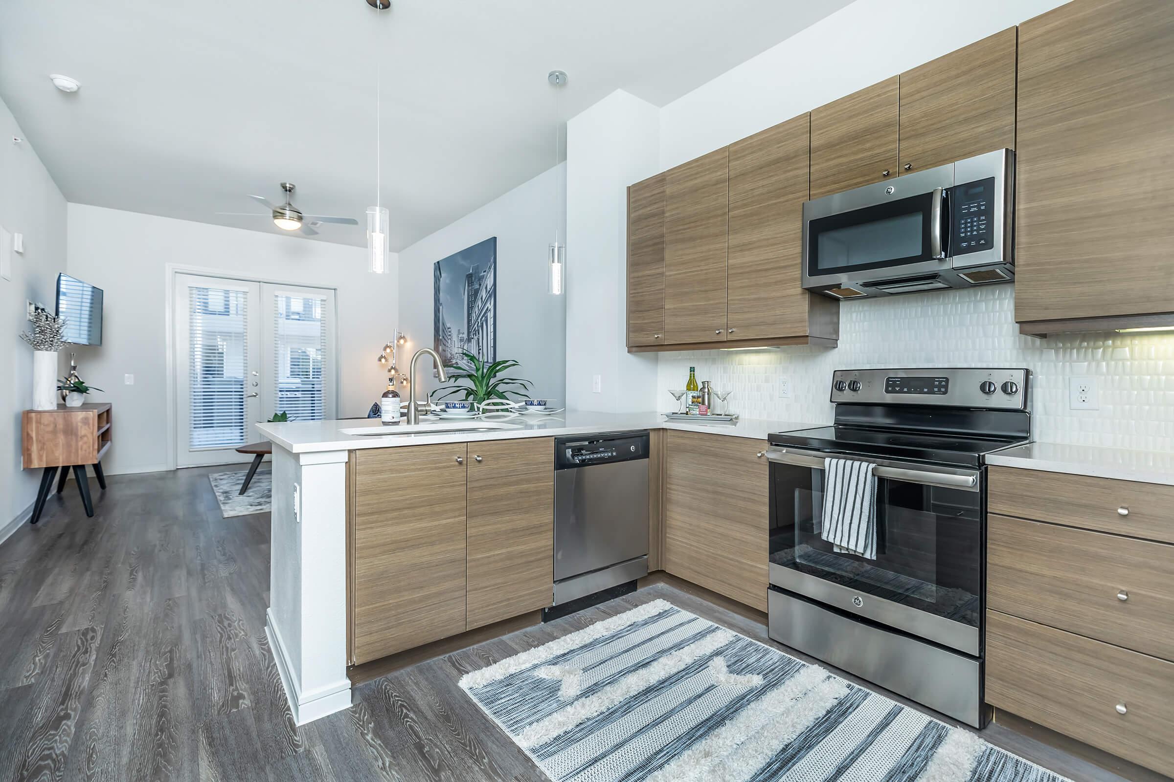 a living room filled with furniture and a stove