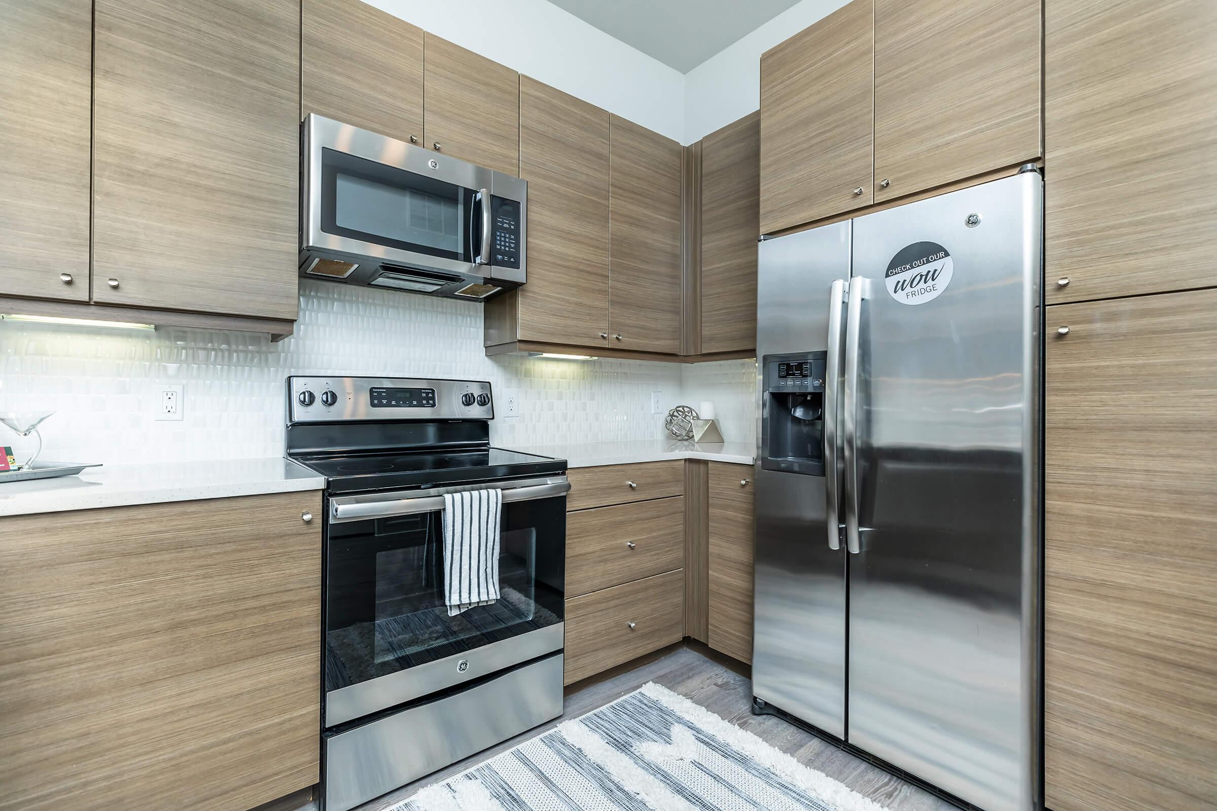 a stove top oven sitting inside of a kitchen