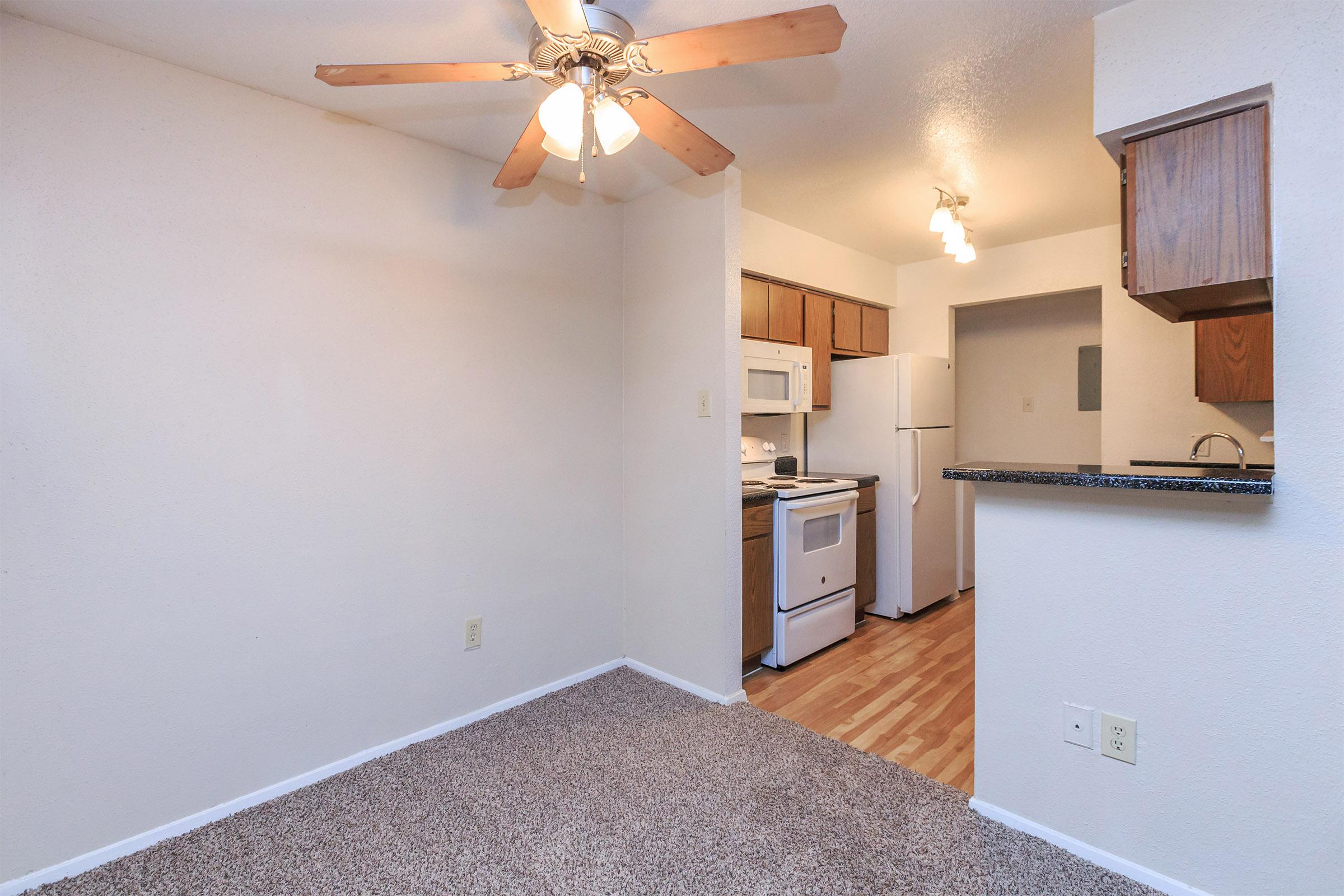 a kitchen with a sink and a refrigerator