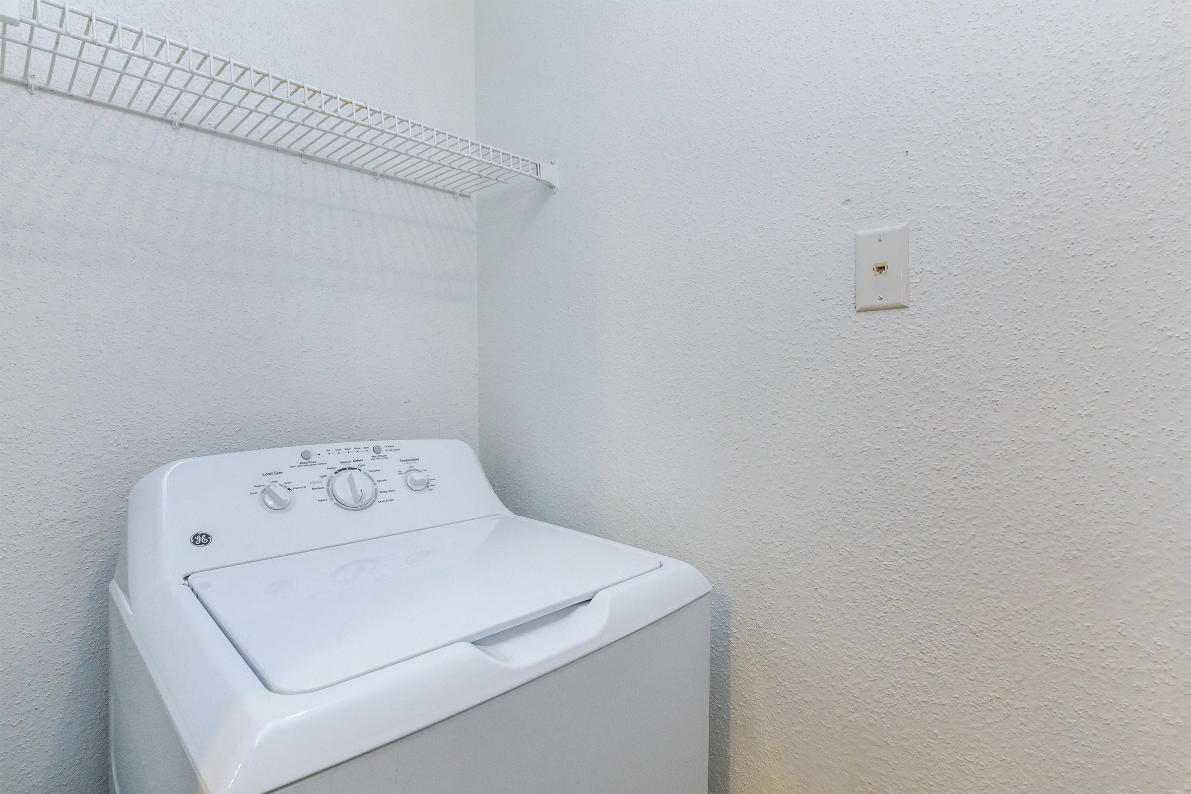 a white refrigerator freezer sitting in a room