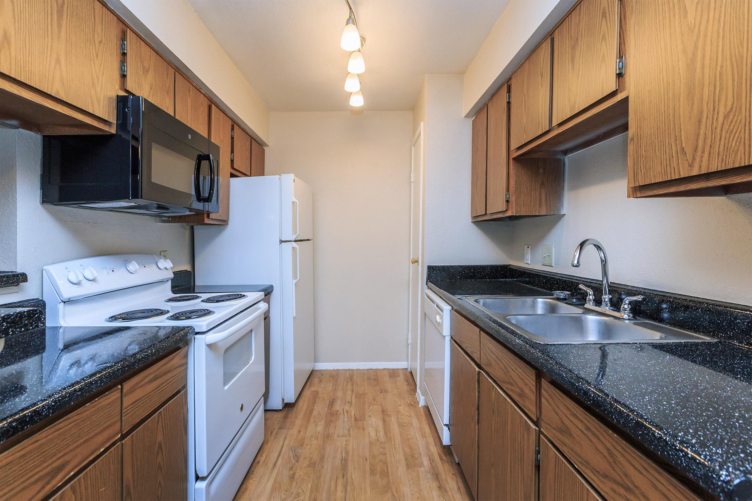 a kitchen with a stove top oven