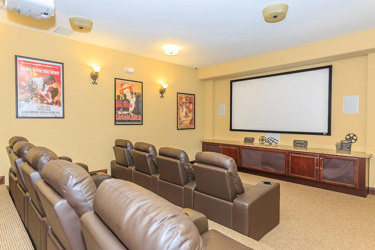 a living room filled with furniture and a flat screen tv