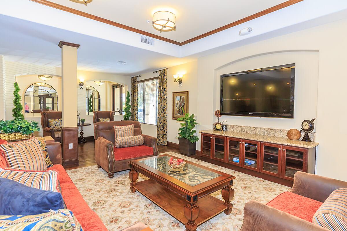 a living room filled with furniture and a fire place