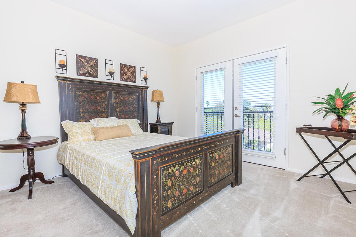 a living room filled with furniture and a large window