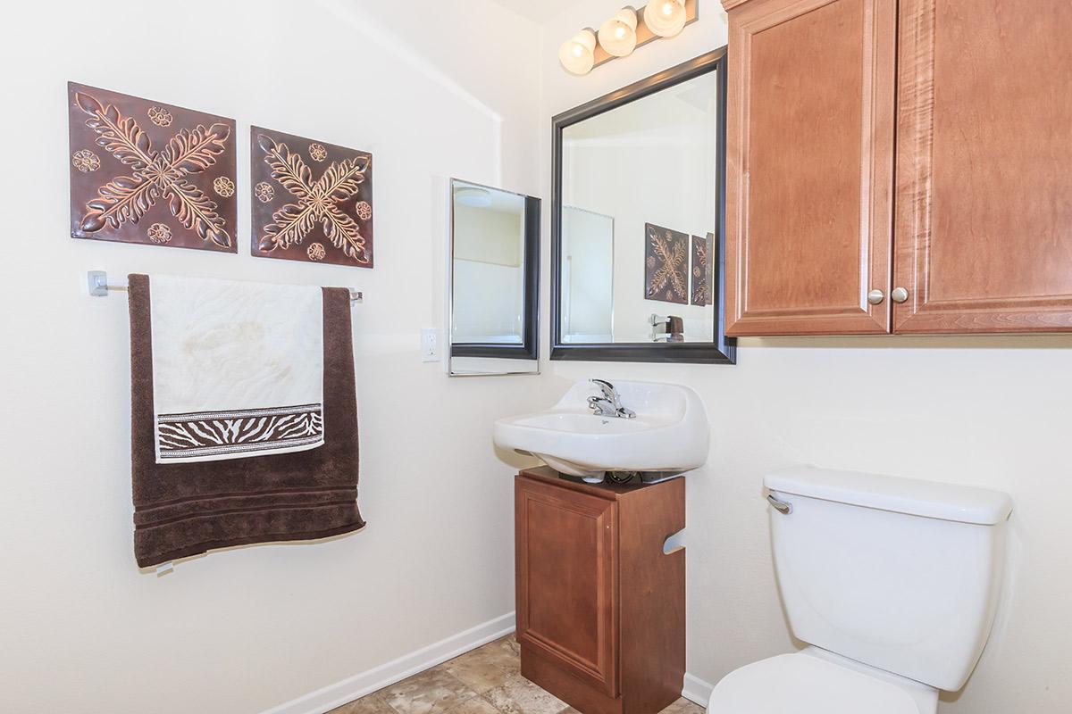 a kitchen with a sink and a mirror