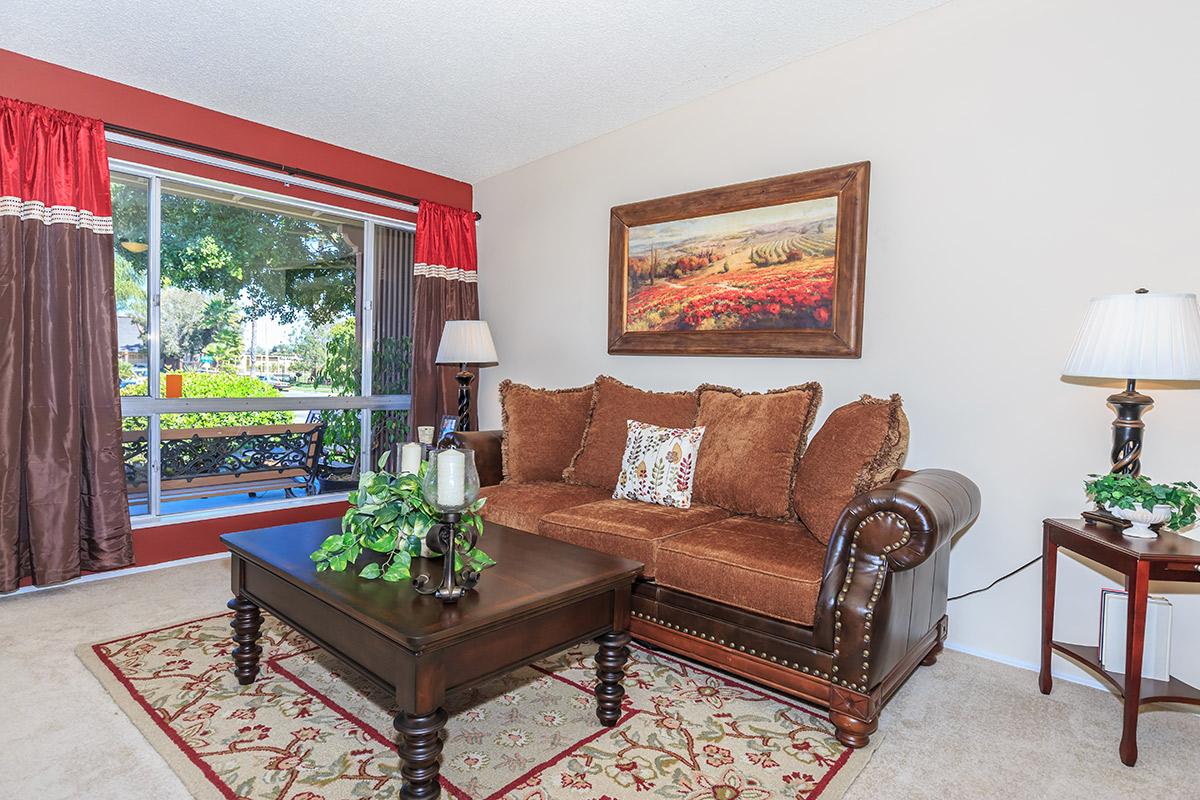 a living room filled with furniture and a fireplace