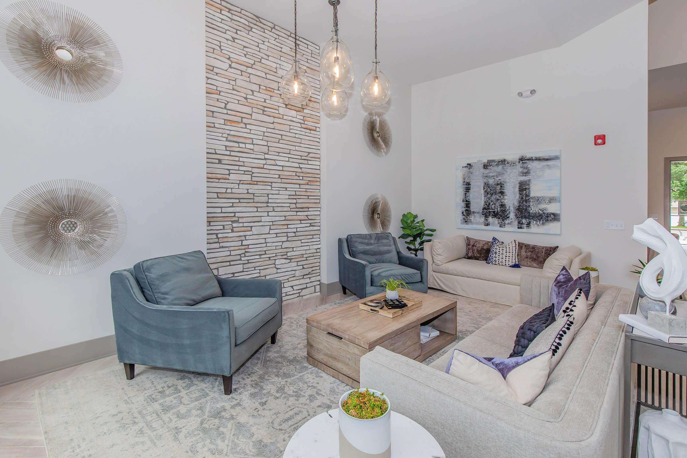 a living room filled with furniture and a table