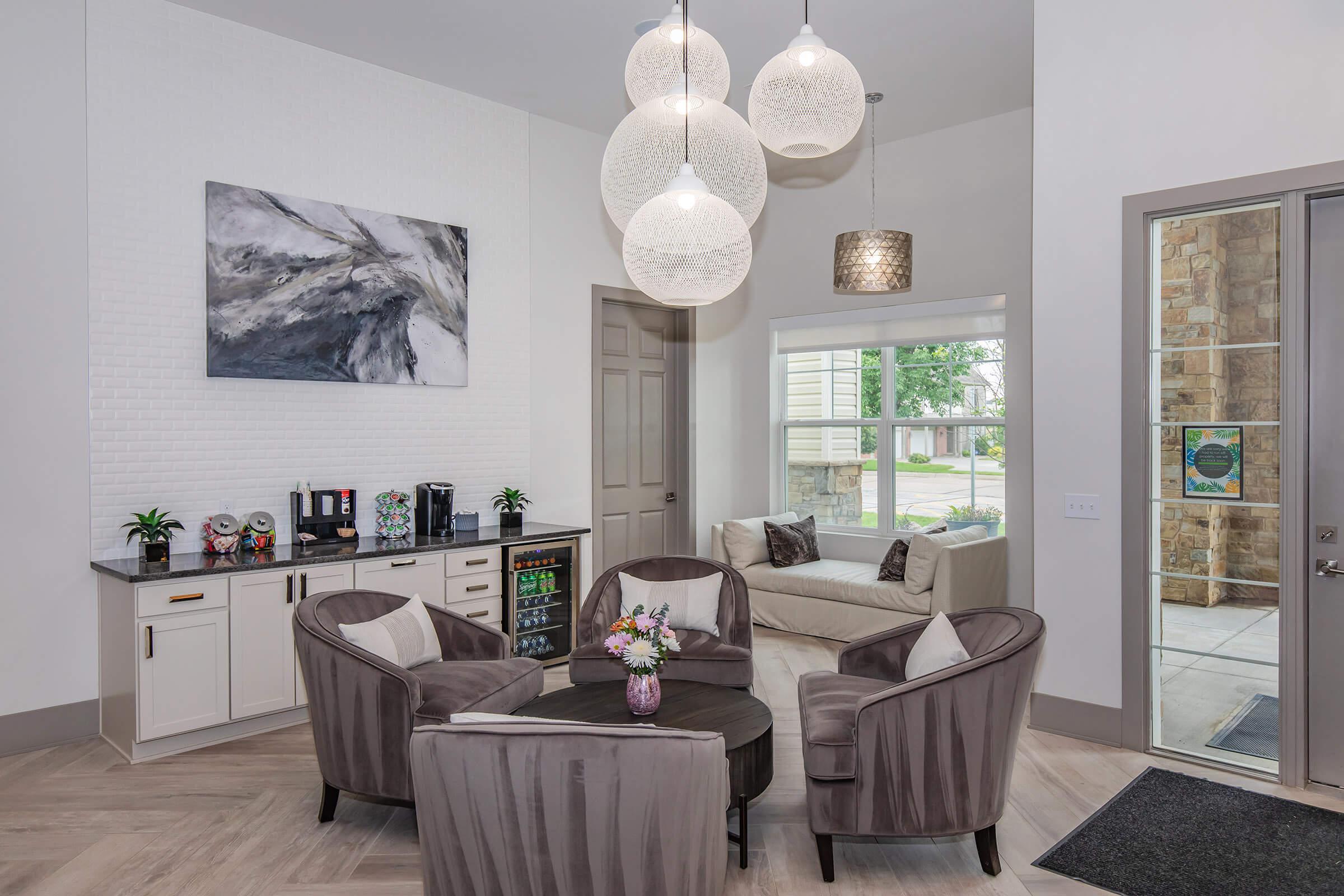 a living room filled with furniture and a fireplace