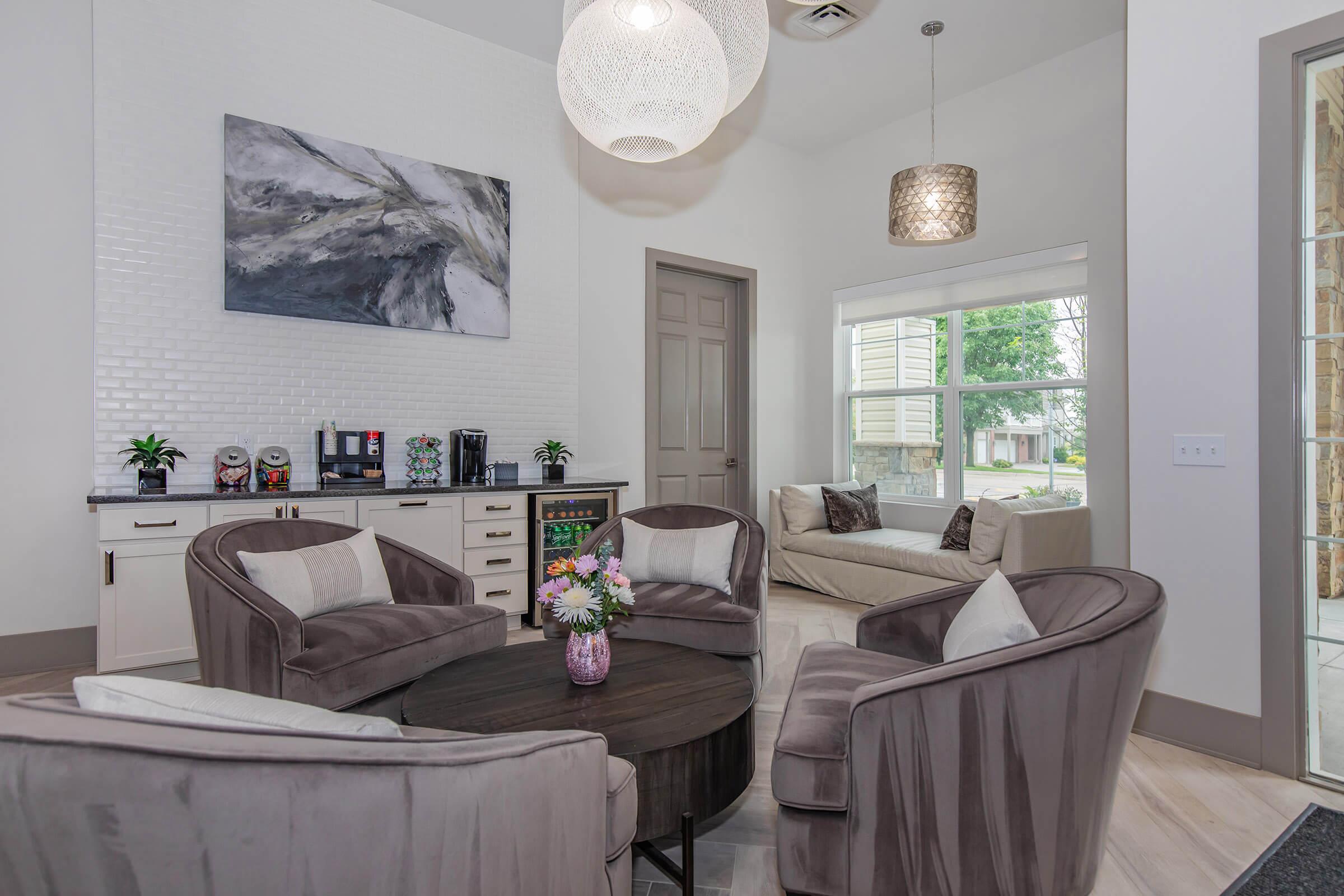 a living room filled with furniture and a fireplace