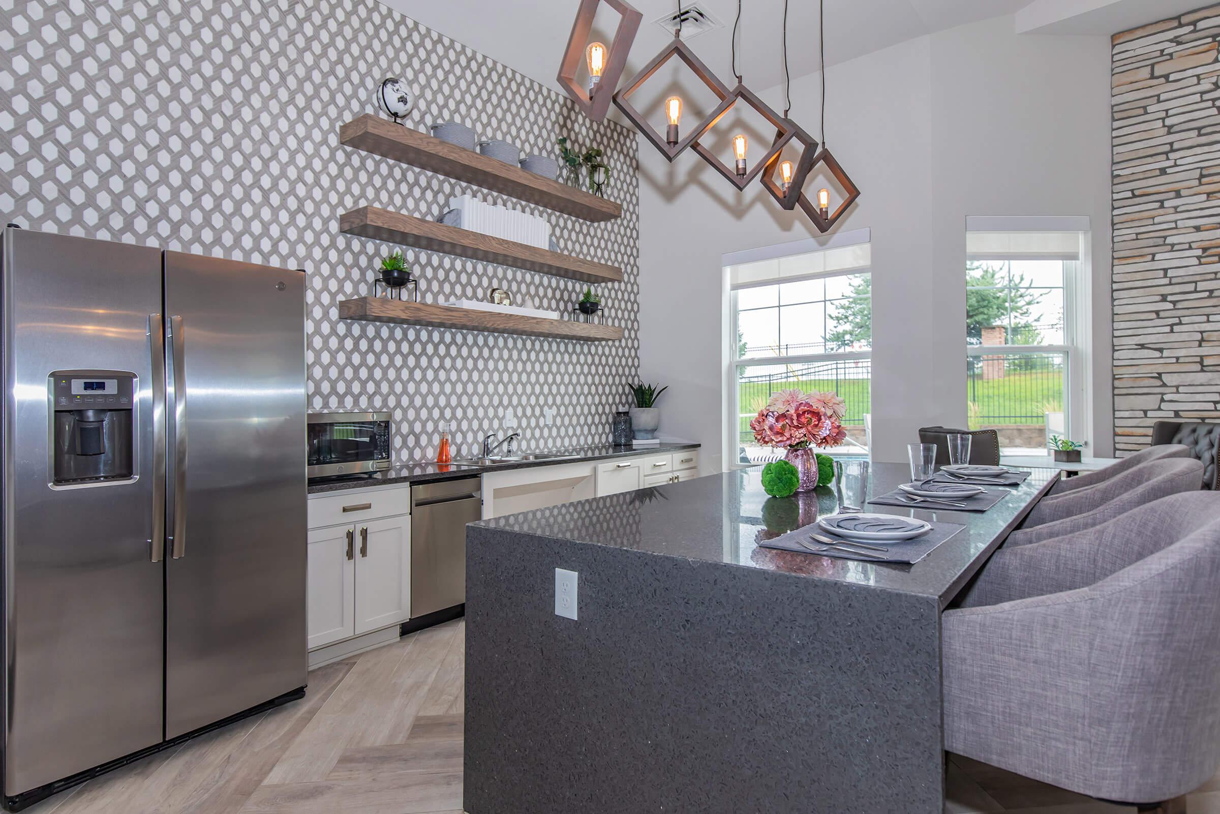 a modern kitchen with stainless steel appliances