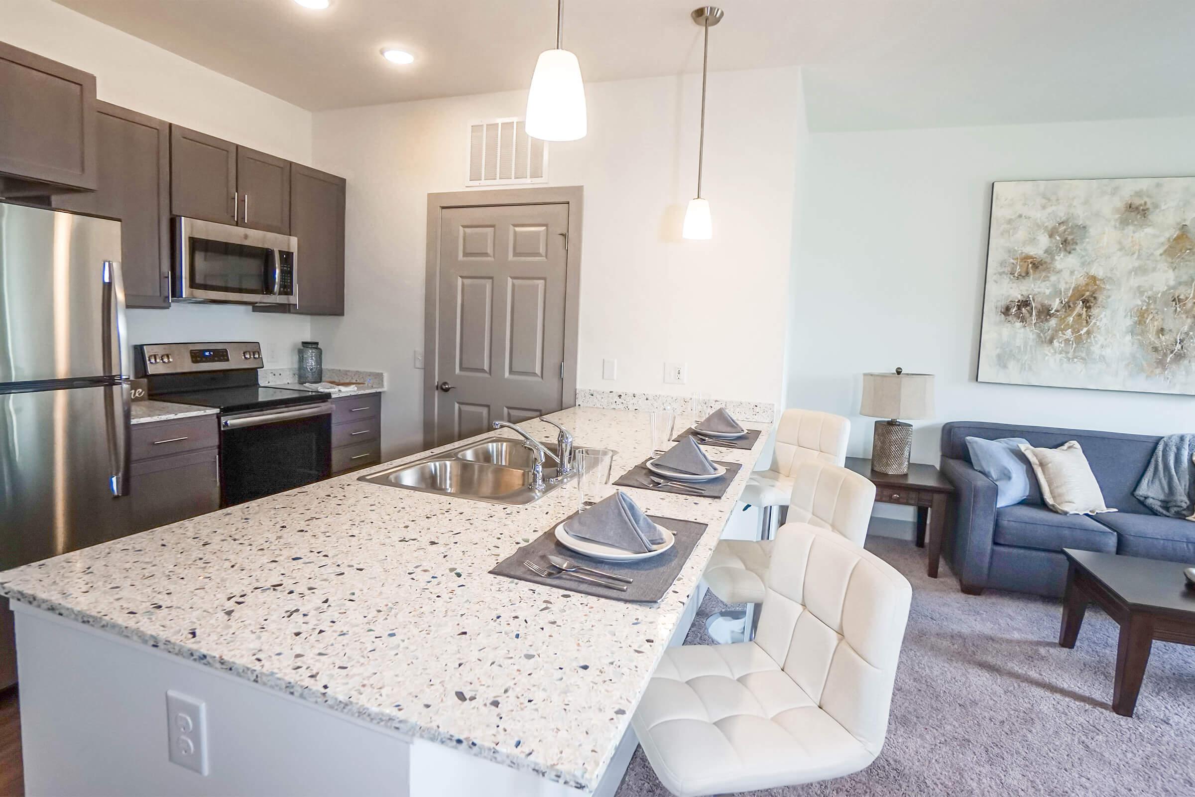 a kitchen with a table in a room