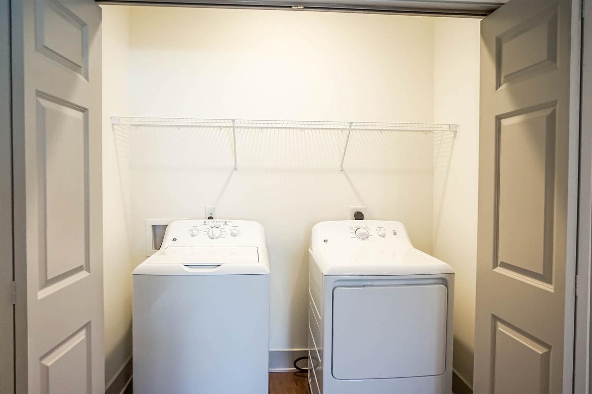 a white refrigerator freezer sitting next to a sink